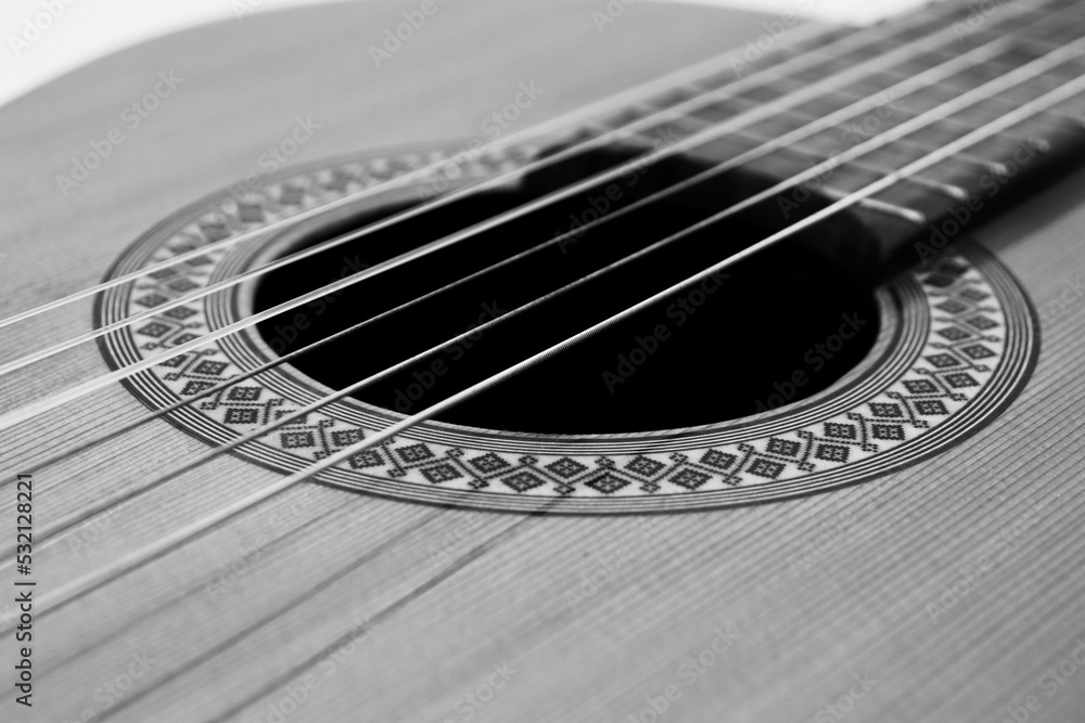 closeup classical guitar isolated on a black and white background closeup classical guitar isolated on a black and white background
