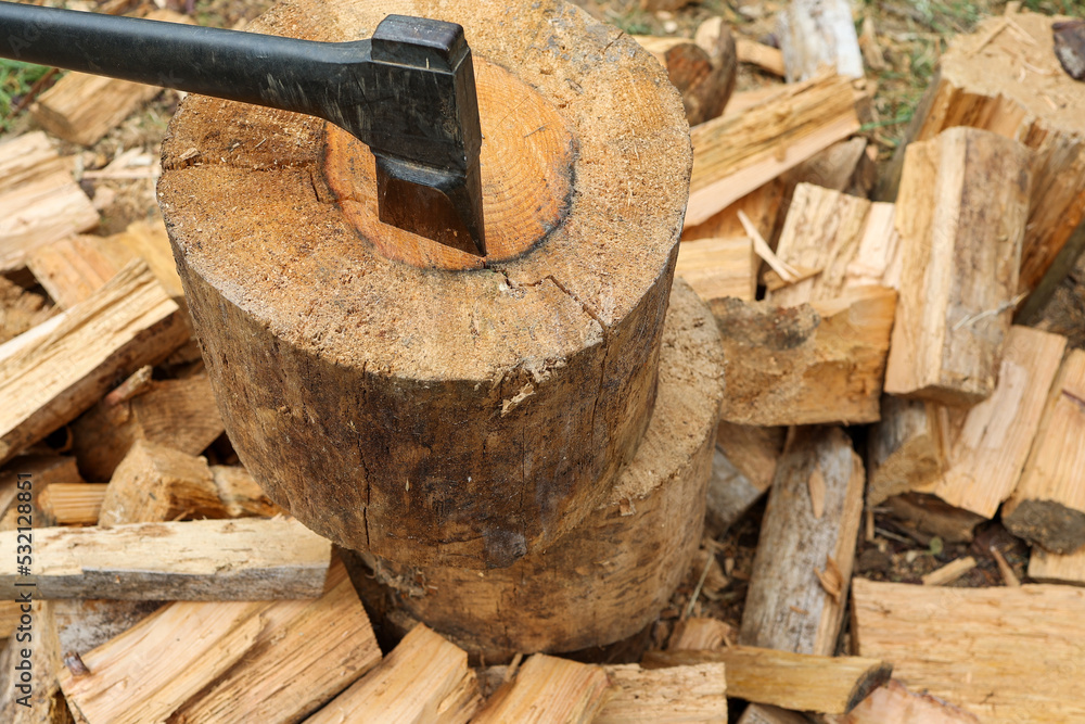 axe and firewood. Renewable and sustainable energy concept