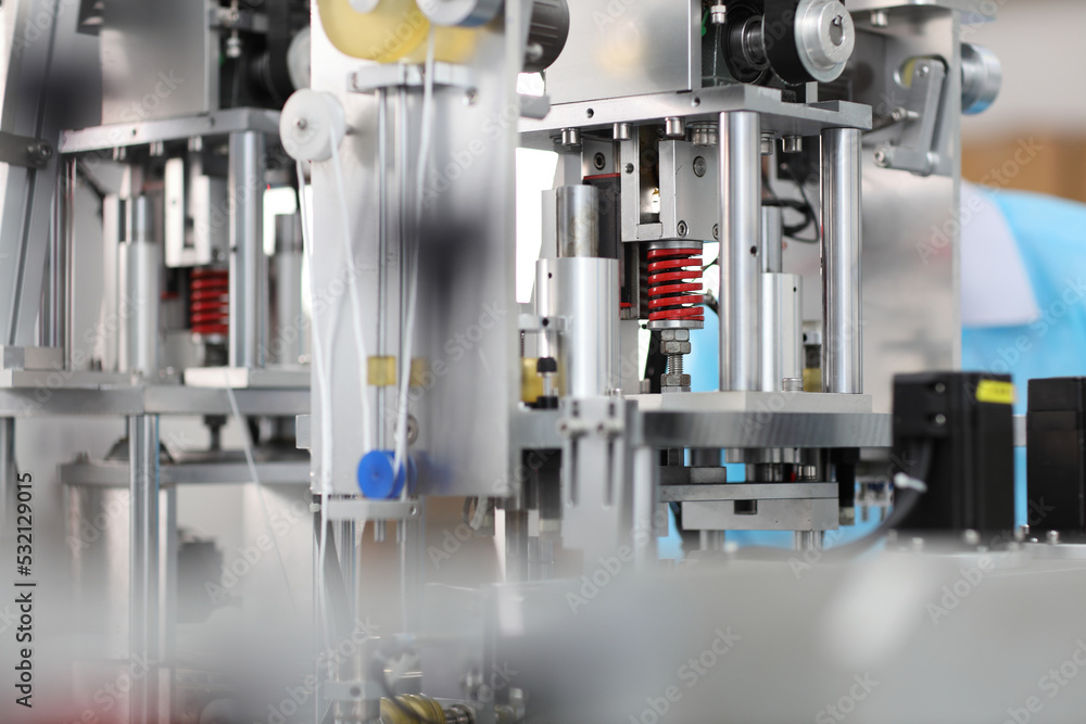 Industry and factory concept, medical face mask production line. Industry and factory concept, medical face mask production line.