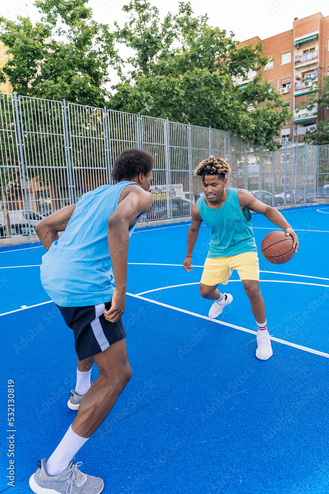 Obraz premium African Friends Playing Basketball