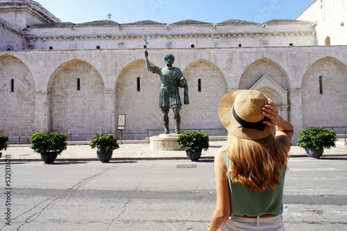 Beautiful young tourist woman visiting the city of Barletta, Apulia, Italy