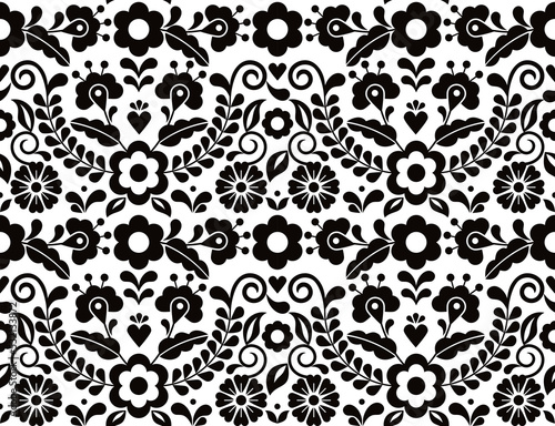Seamless vector pattern with Mexican floral morif, black and white textile or fabric print design inspired by traditional embroidery crafts from Mexico
 