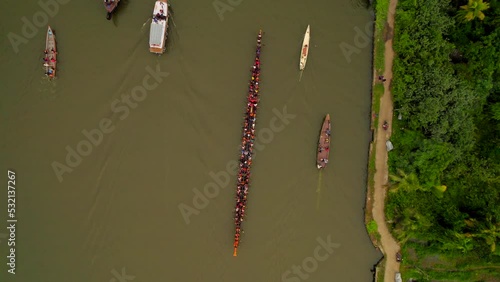 Aerial top down view of several boats including Vallam Kali traditional race boat in Kerala photo