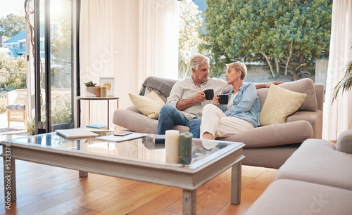 Relax, retirement and coffee with elderly couple bonding on a sofa, enjoying a peaceful morning in their living room together. Love, man and woman enjoying, break, relationship and cozy conversation © Kirsten Davis/peopleimages.com