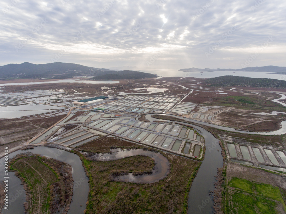 Aerial view of fish farming pools at land. Sea fish farm. Cages for fish farming dorado and seabass. 