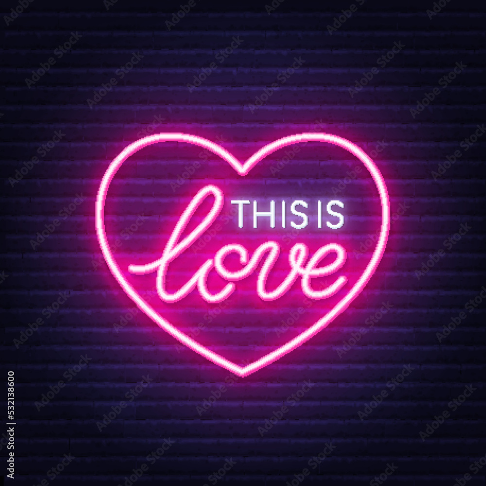 This is Love neon sign in heart shaped frame on brick wall background.