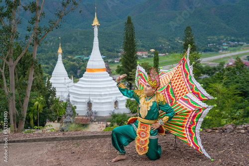 Beautiful Burmese Art dancing performs imitating bird wings shown at the Mae Hong Son, Thailand. photo