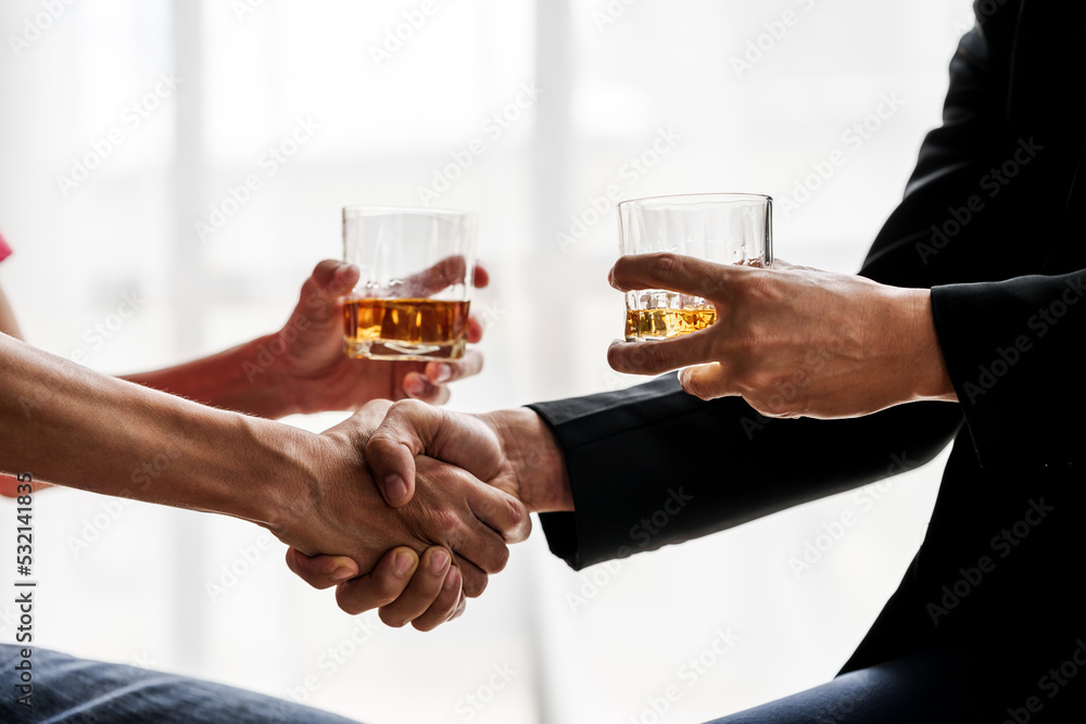 Sad depressed addicted drunk guy, Alone asian man drinker alcoholic sitting at bar counter with glass drinking whiskey. shaking hands.