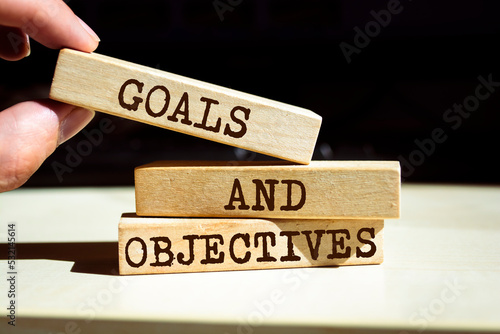 Wooden blocks with words 'Goals and Objectives'.