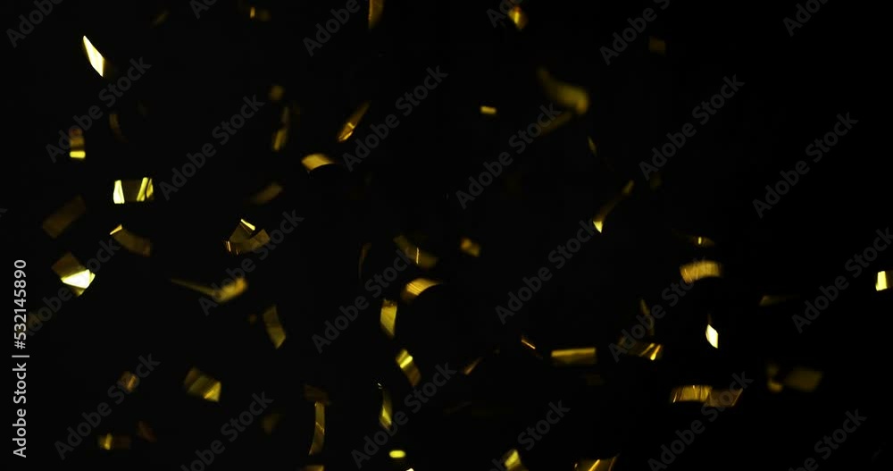 Falling foil confetti with gold glitter on a black background. Stock ...