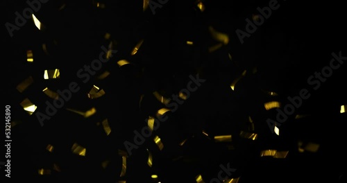 Falling foil confetti with gold glitter on a black background.