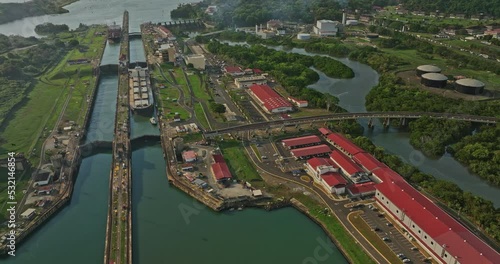 Panama City Aerial v42 industrial establishing shot birds eye view capturing commercial cargo ships at miraflores locks transiting through the water canal - Shot with Mavic 3 Cine - March 2022 photo