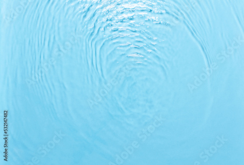 Background with water  waves on the water in the pool during the day  cosmetic moisturizer emulsion