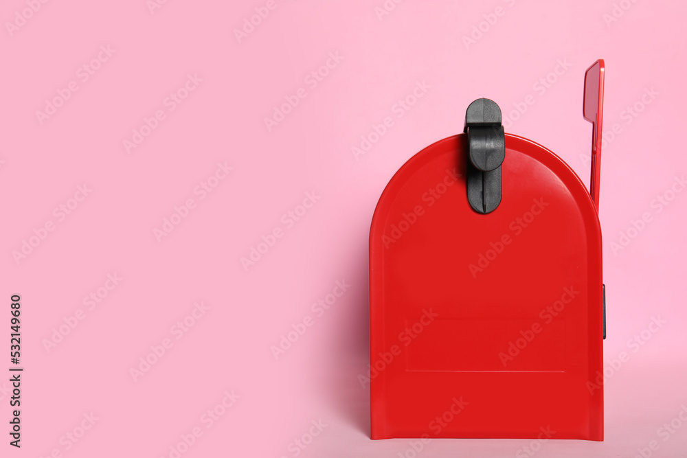 Closed red letter box on pink background. space for text Closed red letter box on pink background. space for text
