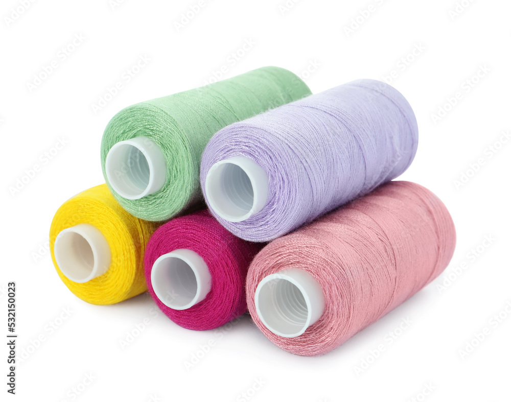 Different colorful sewing threads on white background Different colorful sewing threads on white background
