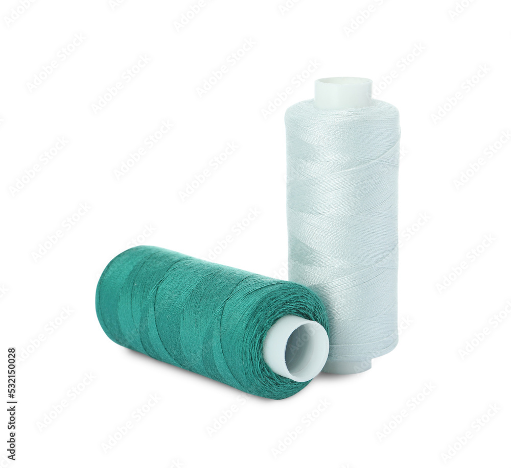 Different colorful sewing threads on white background Different colorful sewing threads on white background