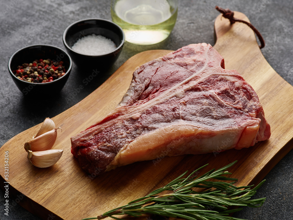Tbone or porterhouse raw steak of beef cut from the short loin. Steak