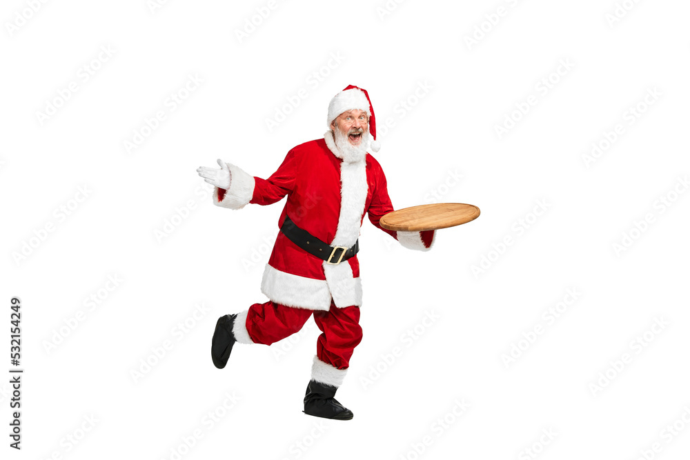 Portrait of senior man in image of Santa Claus posing with cutting board isolated over white background. Serving food Portrait of senior man in image of Santa Claus posing with cutting board isolated over white background. Serving food