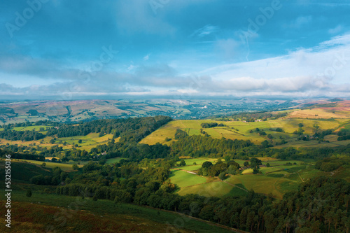 Panorama of welsh countryside. British landscape. Aerial panoramic view of typical british farmers fields and some sheep. England UK. Scenic British Countryside at Summer.  © Strikernia