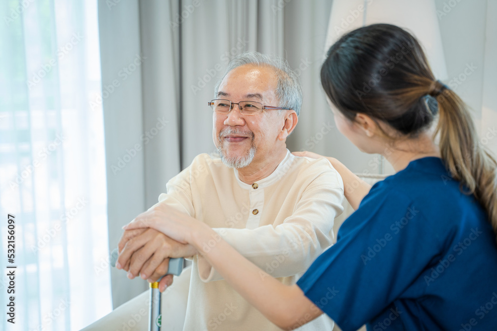 Obraz premium Caregiver talking to senior man in bedroom,Medical help trust support encourage reassure patient,Home care service.