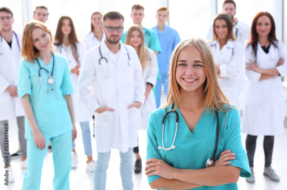 team of diverse medical professionals applauds together. team of diverse medical professionals applauds together.