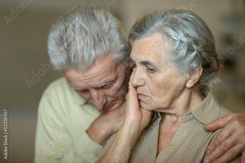 Portrait of a elderly couple being sad together