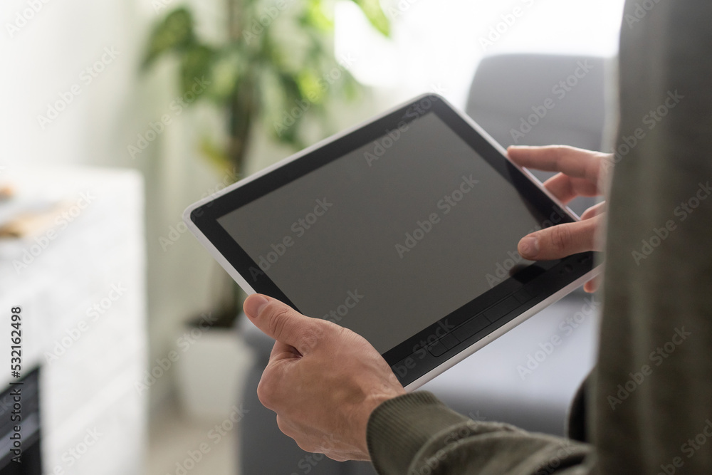 man holding digital tablet, closeup man holding digital tablet, closeup