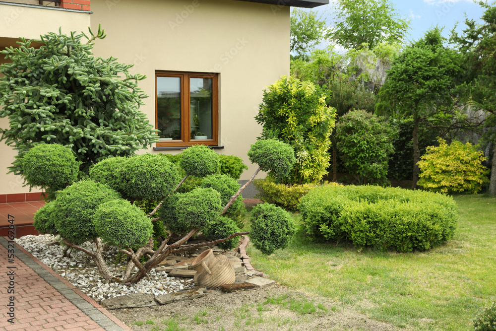 Picturesque view of beautiful house and garden on sunny day