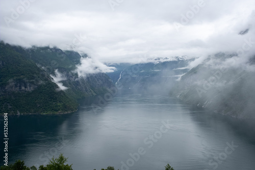 Wonderful landscapes in Norway. Vestland. Beautiful scenery of Geiranger Fjord from the Ljoen viewpoint. Rainy day. Selective focus
