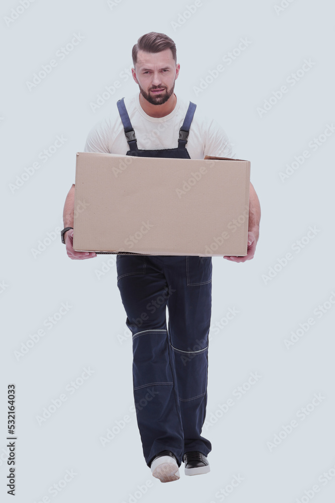 in full growth. a smiling man with cardboard boxes on his shoulders in full growth. a smiling man with cardboard boxes on his shoulders