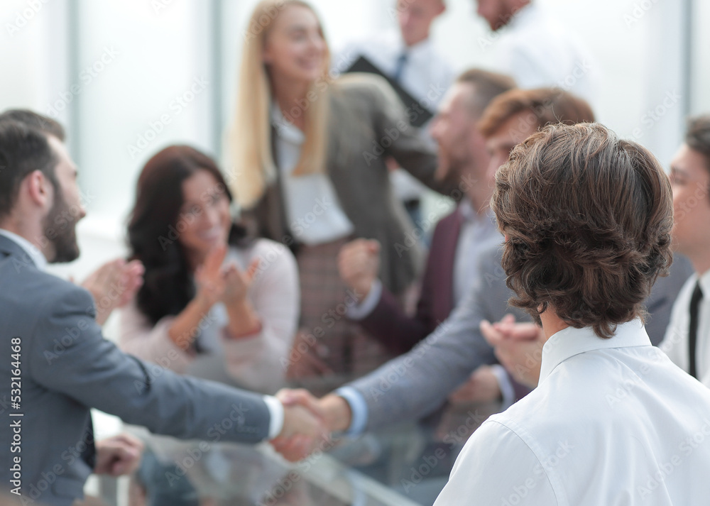 business partners shaking hands as a sign of cooperation business partners shaking hands as a sign of cooperation