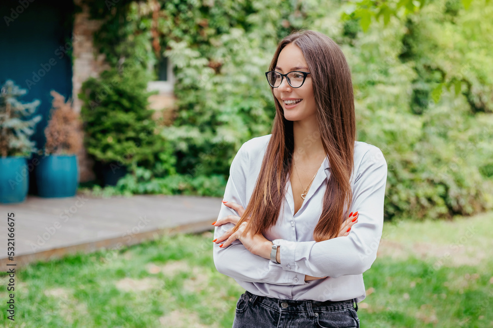 smiling brunette girl in glasses against the background of nature copy space smiling brunette girl in glasses against the background of nature copy space