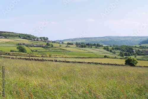 view of the calder valley in west yorkshire with village houses visible in the distance