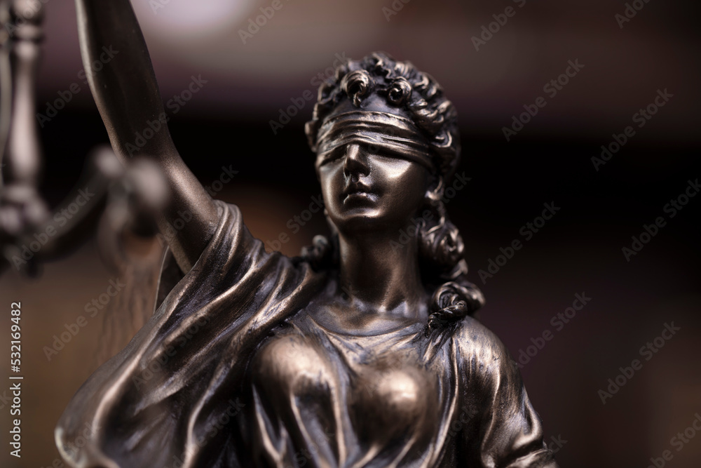 Law and justice concept. Justice symbol - Themis sculpture on gray background. Law and justice concept. Justice symbol - Themis sculpture on gray background.