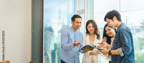 Wallpaper Mural Young start up team Asian man and woman work together in a modern office, Brainstrom business team is responsible for solving the tasks. Torontodigital.ca
