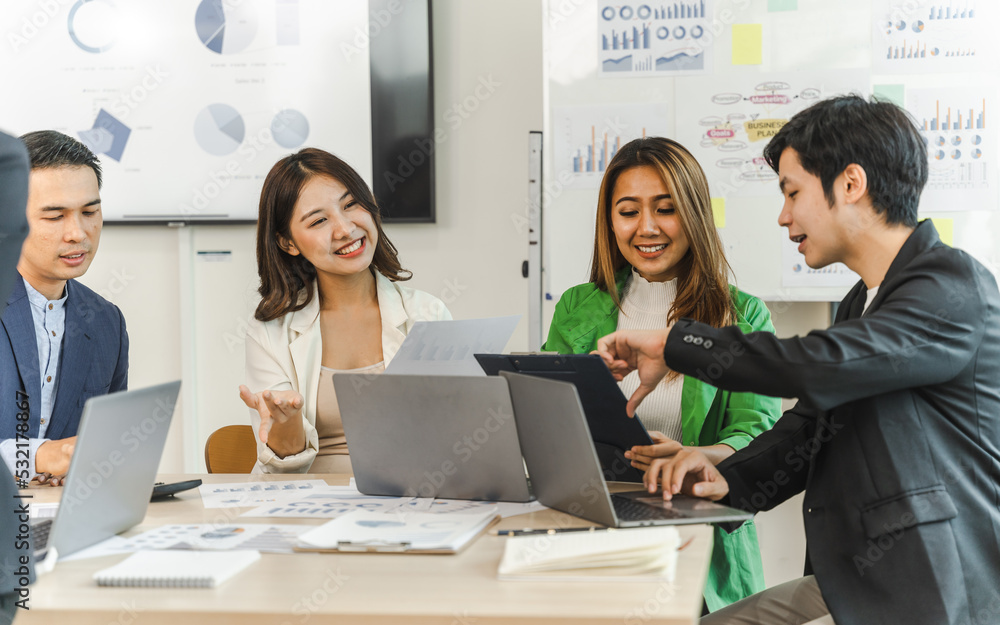 Multiracial business team on a meeting in a modern bright office, Diverse colleagues working on project together, sitting at table in boardroom. Multiracial business team on a meeting in a modern bright office, Diverse colleagues working on project together, sitting at table in boardroom.
