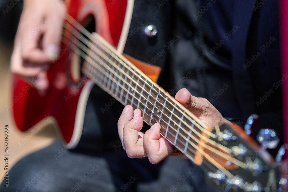 Russia. Saint-Petersburg. The musician plays a six-string guitar.