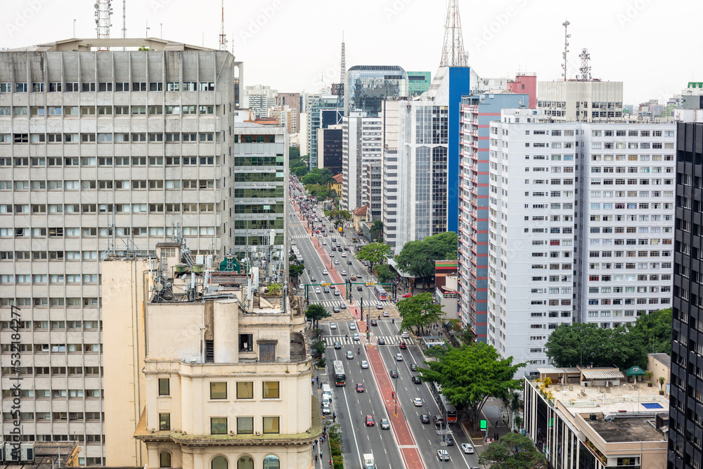 Fototapeta premium Beautiful aerial view of Paulista avenue, Sao Paulo city skyline. Street cityscape with modern buildings and car traffic. Concept of architecture, urban, metropolis, Brazil, South America.