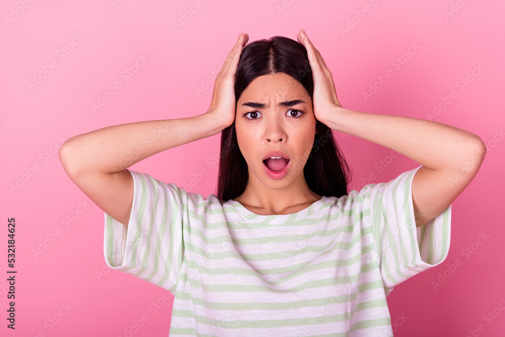 Portrait of confused speechless filipino person hands touch head open mouth isolated on pink color background Portrait of confused speechless filipino person hands touch head open mouth isolated on pink color background