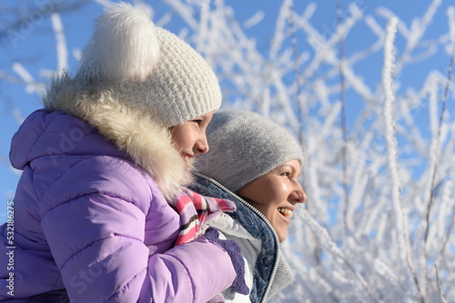 Beautiful mother and daughter enjoy winter together
