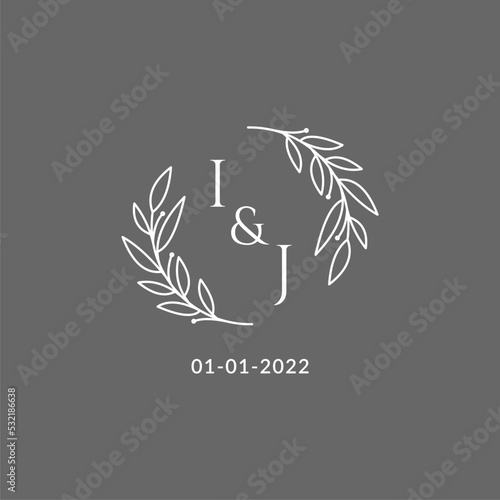 Initial letter IJ monogram wedding logo with creative leaves decoration photo