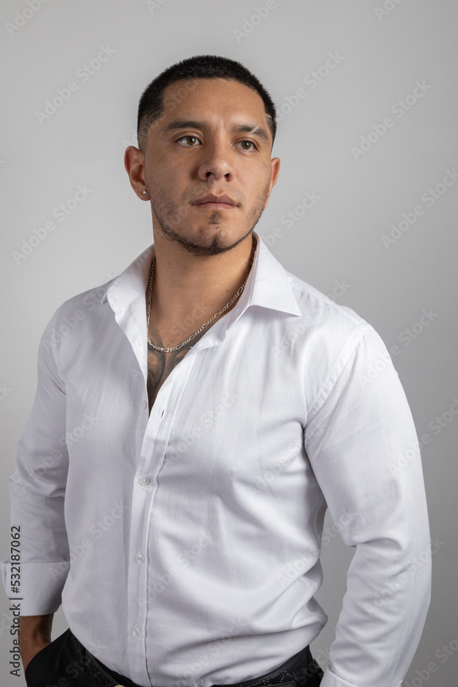 young latin man with short hair wear a white shirt, formal fashion in studio, beauty and lifestyle young latin man with short hair wear a white shirt, formal fashion in studio, beauty and lifestyle