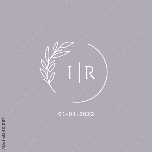 Initial monogram IR wedding logo with decorative floral frame
