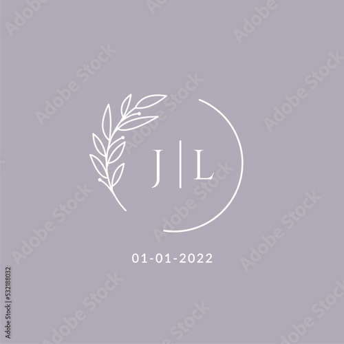 Initial monogram JL wedding logo with decorative floral frame photo