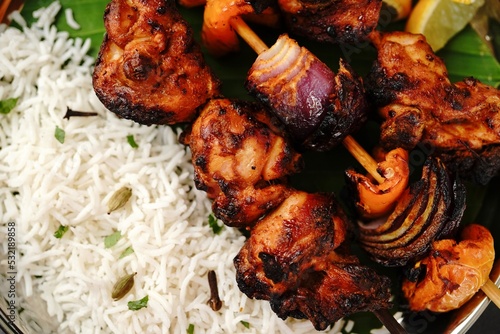 Grilled chicken tikka kebab or kababs on skewer, selective focus photo