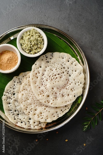 Fenugreek methi dosa Venthaya Dosai - healthy south Indian breakfast with chuney, top down view photo