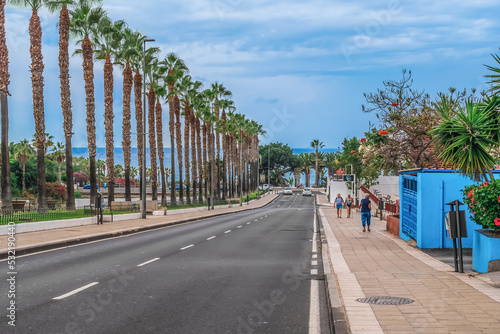 Puerto de la Cruz, Spain - November 25, 2021: View of the Atlantic Ocean from Avenida Blas Perez Gonzalez street in Puerto de la Cruz. Urban exotic landscape on the island of eternal spring photo