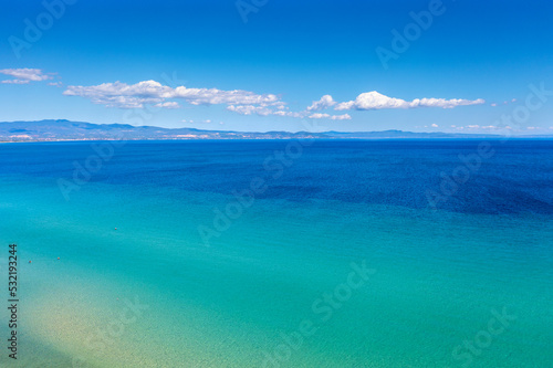 Fototapeta Naklejka Na Ścianę i Meble -  Seascape on a sunny day, view of sunny bay in Aegean sea in Chalkidiki, Greece