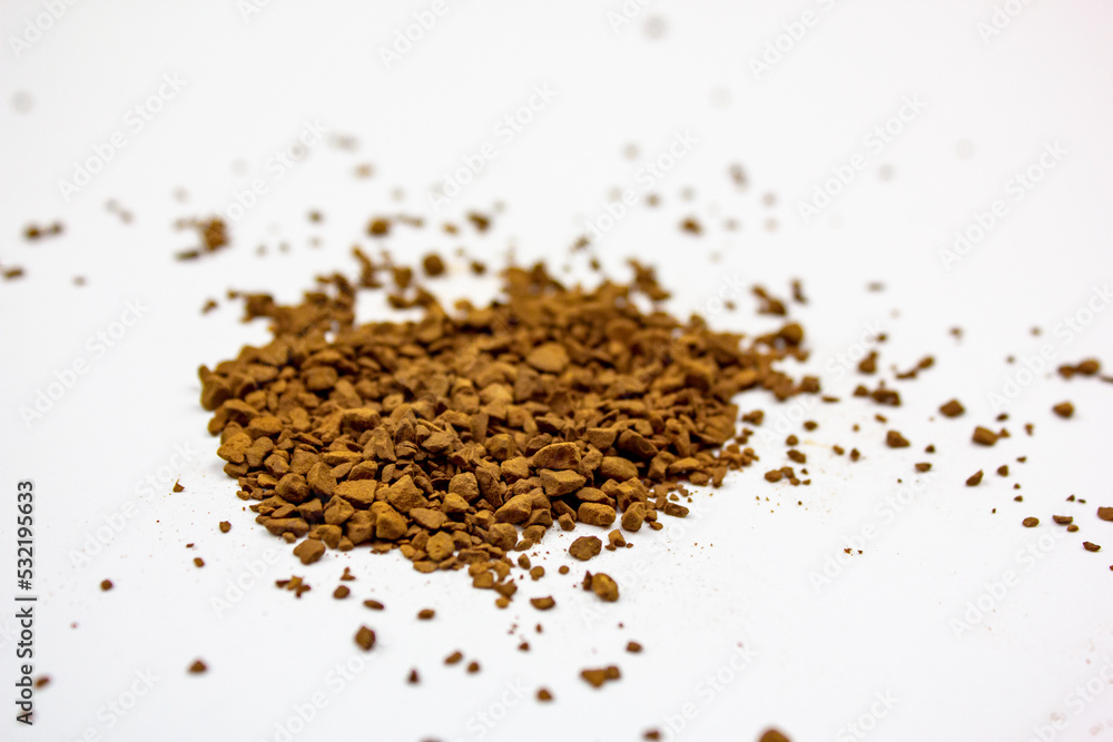 Coffee black instant on an isolated white background. Granules of instant natural coffee. Coffee black instant on an isolated white background. Granules of instant natural coffee.