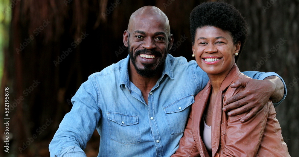 Two African people smiling at camera. Black couple together Two African people smiling at camera. Black couple together